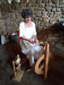 Marie-Claude spinning at a traditional festival